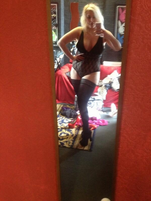 Mirror selfie in black stockings